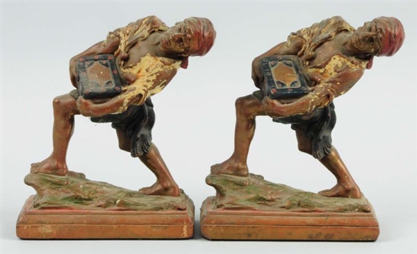 PAIR OF PIRATE COMPOSITION BOOKENDS.              
