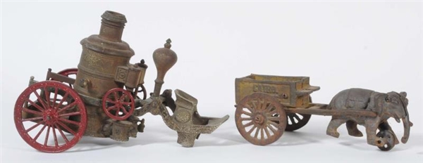 LOT OF 2: CAST IRON WAGONS WITH ELEPHANT.         