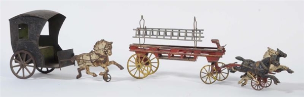 LOT OF 2: TIN HORSE WAGONS WITH CAST IRON HORSES. 