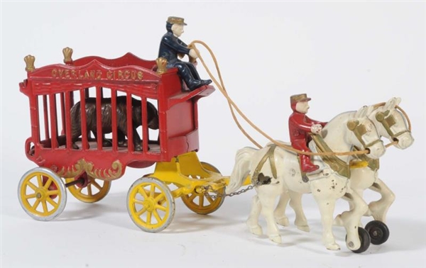 CAST IRON CIRCUS WAGON WITH HORSE.                