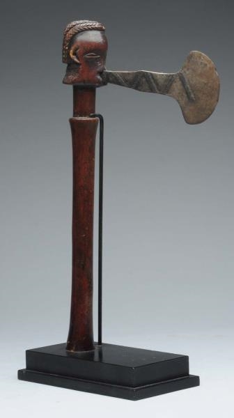 AFRICAN WAR AXE WITH CARVED WOODEN HEAD.          