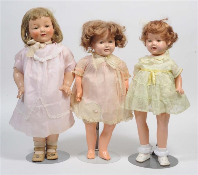 LOT OF 3: COMPOSITION DOLLS ON CLOTH BODIES.      