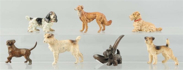 LOT OF 7: CAST IRON ASSORTED DOGS.                