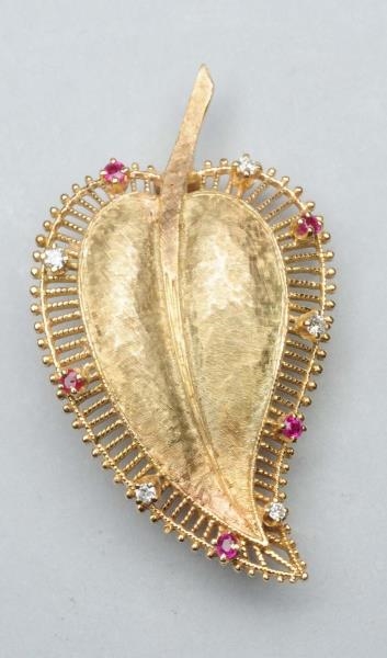 14K LEAF PIN WITH RUBIES.                         