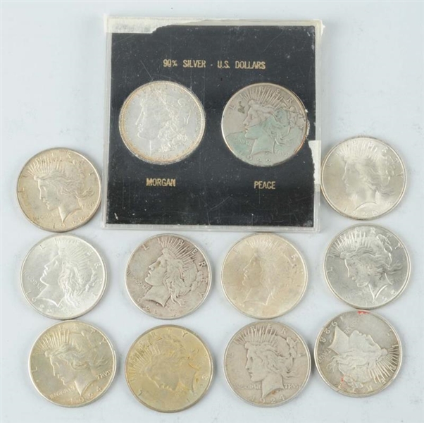 LOT OF 12: SILVER DOLLARS.                        