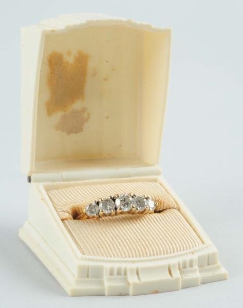 10K YG DIAMOND WEDDING RING.                      