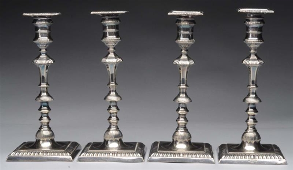 SET OF 4 ENGLISH SILVER PLATED CANDLESTICKS.      