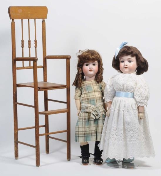 LOT OF 2: BISQUE DOLLS & CHAIR.                   