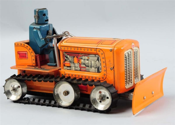 JAPANESE TIN LITHO ROBOT DRIVING TRACTOR TOY.     