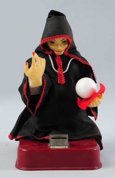 BATTERY-OPERATED GYPSY FORTUNE TELLER TOY.        