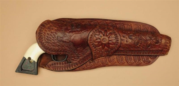 FINE HAND-TOOLED COWBOY EMBOSSED HOLSTER.         