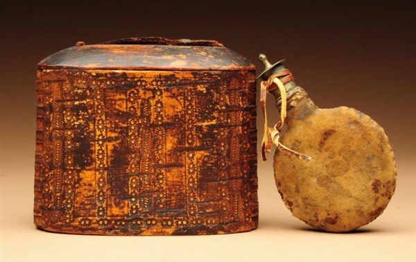 STAMPED WOODLAND INDIAN TOBACCO CASE & FLASK.     