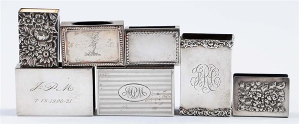 LOT OF 7: STERLING MATCH BOX HOLDERS.             
