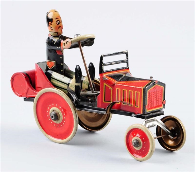 MARX TIN WIND-UP RED CAR.                         