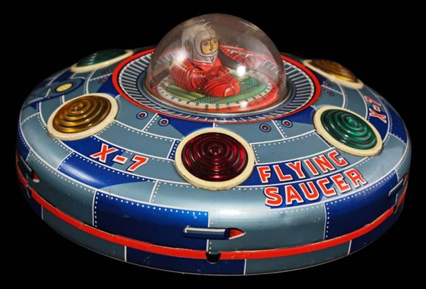 JAPANESE X–7 FLYING SAUCER WITH TIN ASTRONAUT TOY 