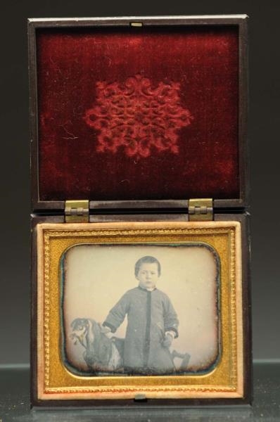 DAGUERREOTYPE OF YOUNG BOY WITH ROCKING HORSE.    