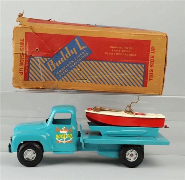 BUDDY L TRUCK WITH BOAT IN BACK.                  