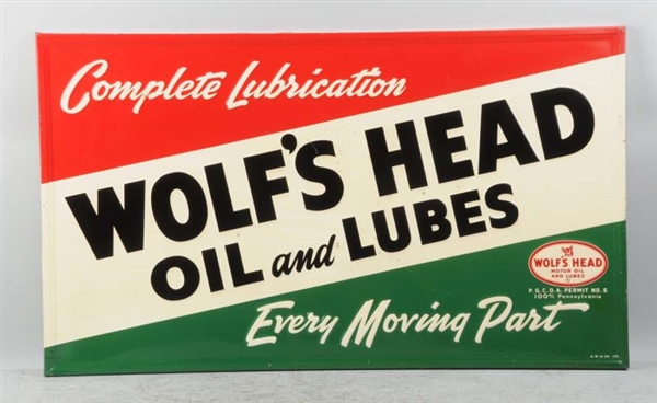 TIN EMBOSSED WOLFS HEAD MOTOR OIL SIGN.          