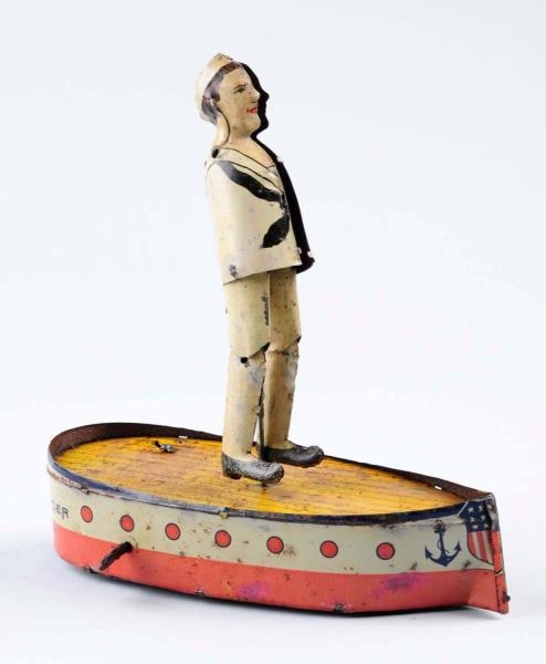 TIN WIND - UP JACKEE THE HORNPIPE DANCER BOAT.    