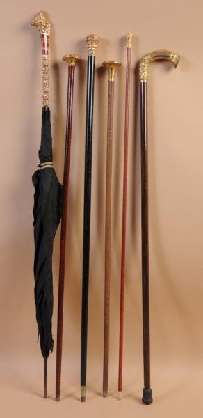LOT OF 5: CANES AND PARASOL.                      