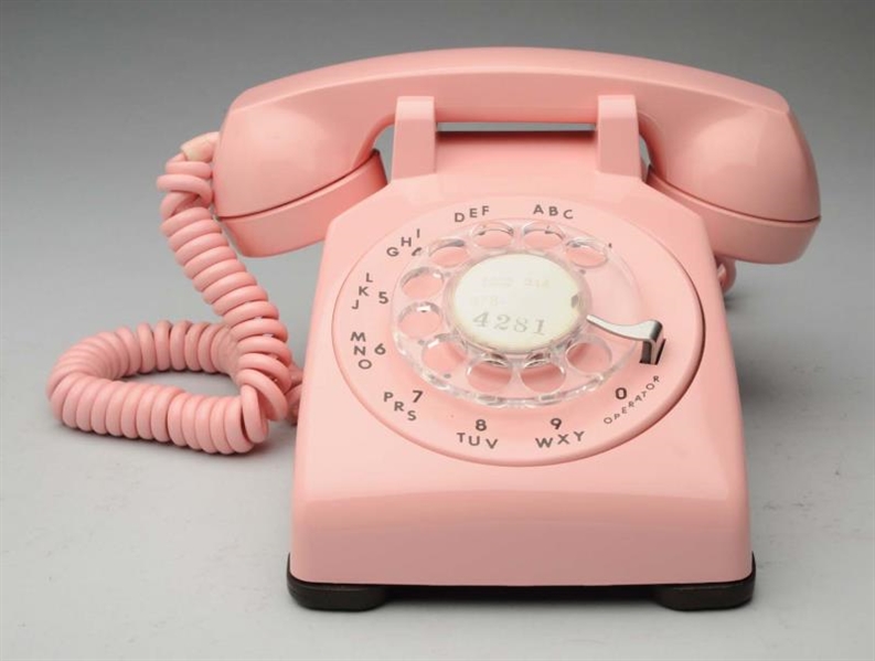 1962 PINK ROTARY DESK PHONE.                      