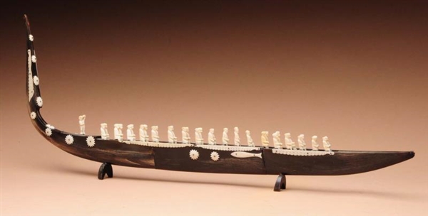 TUSK BOAT WITH IVORY FIGURES.                     