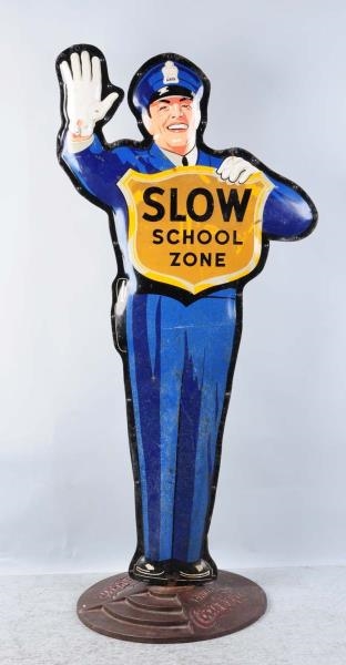 COCA-COLA POLICEMAN SLOW SCHOOL ZONE SIGN.        