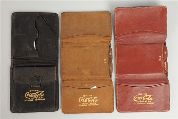 LOT OF 3: COCA - COLA LEATHER WALLETS.            