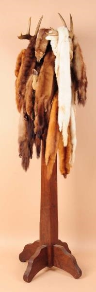 EARLY DEER HORN STAND WITH FURS.                  