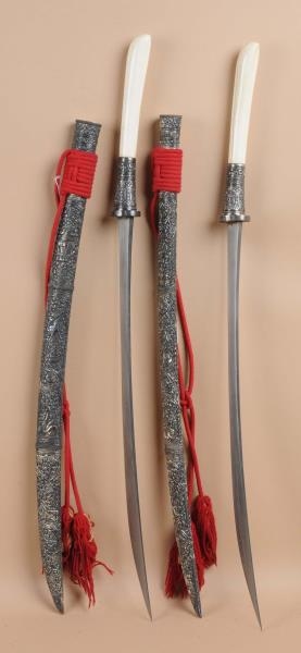 PAIR OF MIDDLE EASTERN IVORY HANDLED SWORDS.      