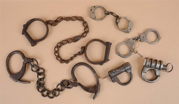 LOT OF ANKLE AND HAND CUFFS.                      