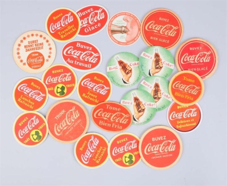 LOT OF 21: MOSTLY FOREIGN COCA - COLA COASTERS.   