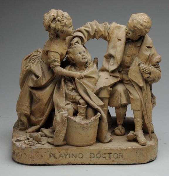 J. ROGERS "PLAYING DOCTOR" PLASTER SCULPTURE.     