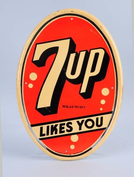 7 - UP TIN OVAL SIGN.                             