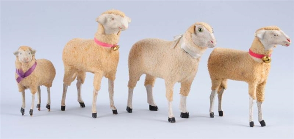 LOT OF 4: WOODEN SHEEP.                           