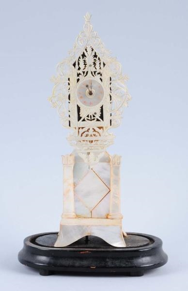 ORNATE MOTHER OF PEARL TABLE CLOCK.               