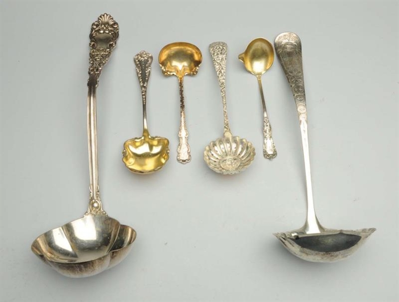 GROUP OF STERLING LADLES.                         