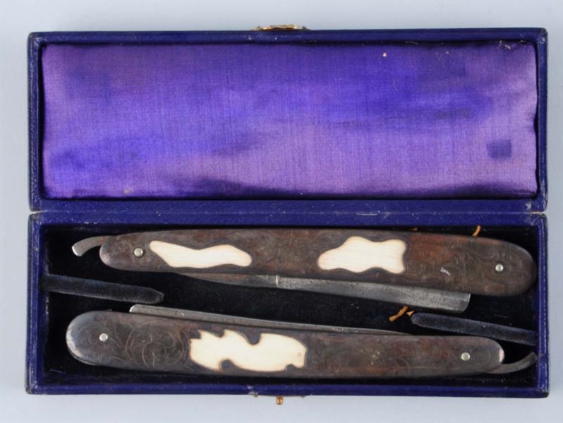 PAIR OF STERLING IVORY RAZORS WITH CASE.          