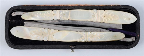 PAIR OF MOTHER OF PEARL RAZORS.                   