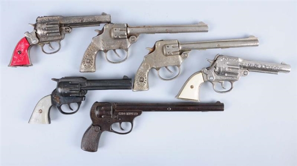 LOT OF 6: AMERICAN MADE CAST IRON CAP GUNS.       