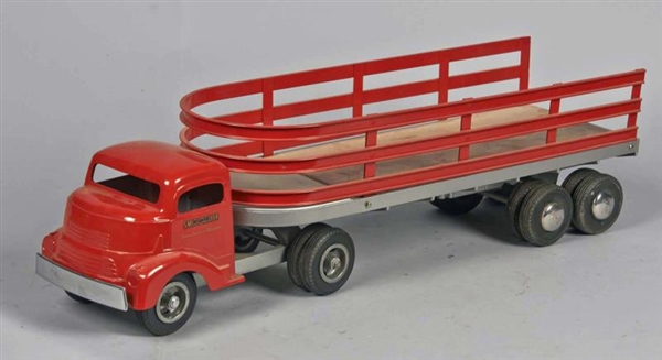 PRESSED STEEL SMITH-MILLER STAKE TRUCK            