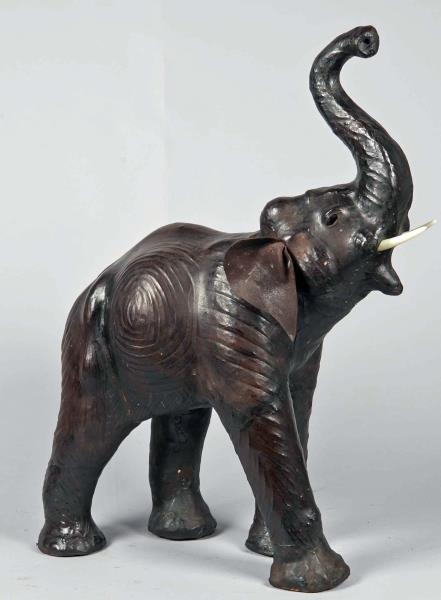 LEATHER WRAPPED CARVED WOOD ELEPHANT              