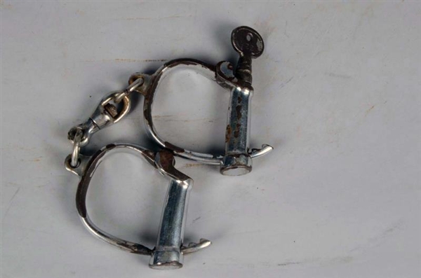 PAIR OF ANTIQUE DARBY-STYLE ADJUSTABLE HANDCUFFS  