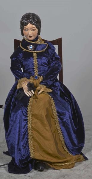 SEATED LADY AUTOMATON IN VICTORIAN OUTFIT.        