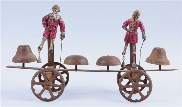 EARLY WHITE METAL AND STEEL DOUBLE BELL TOY.      