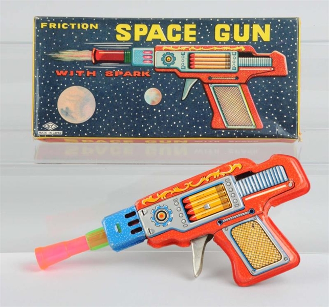 TIN & PLASTIC FRICTION SPACE GUN WITH BOX.        