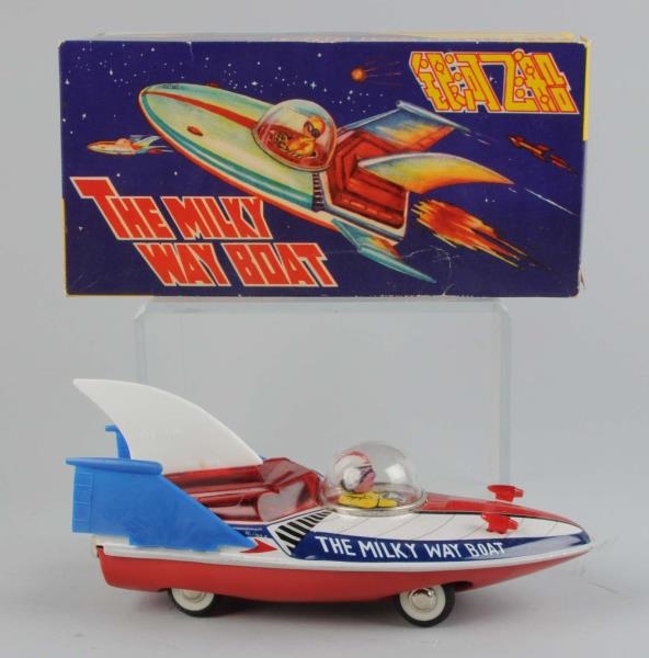 TIN FRICTION MILKY WAY SPACE BOAT WITH BOX.       
