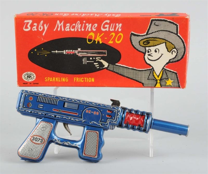 TIN FRICTION BABY MACHINE GUN IN ORIGINAL BOX.    