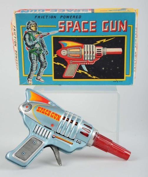 TIN & PLASTIC FRICTION SPACE GUN IN BOX.          