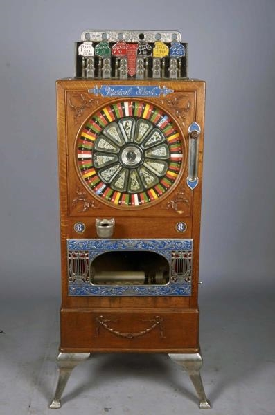 5 ¢ CAILLE MUSICAL PUCK UPRIGHT SLOT MACHINE**    